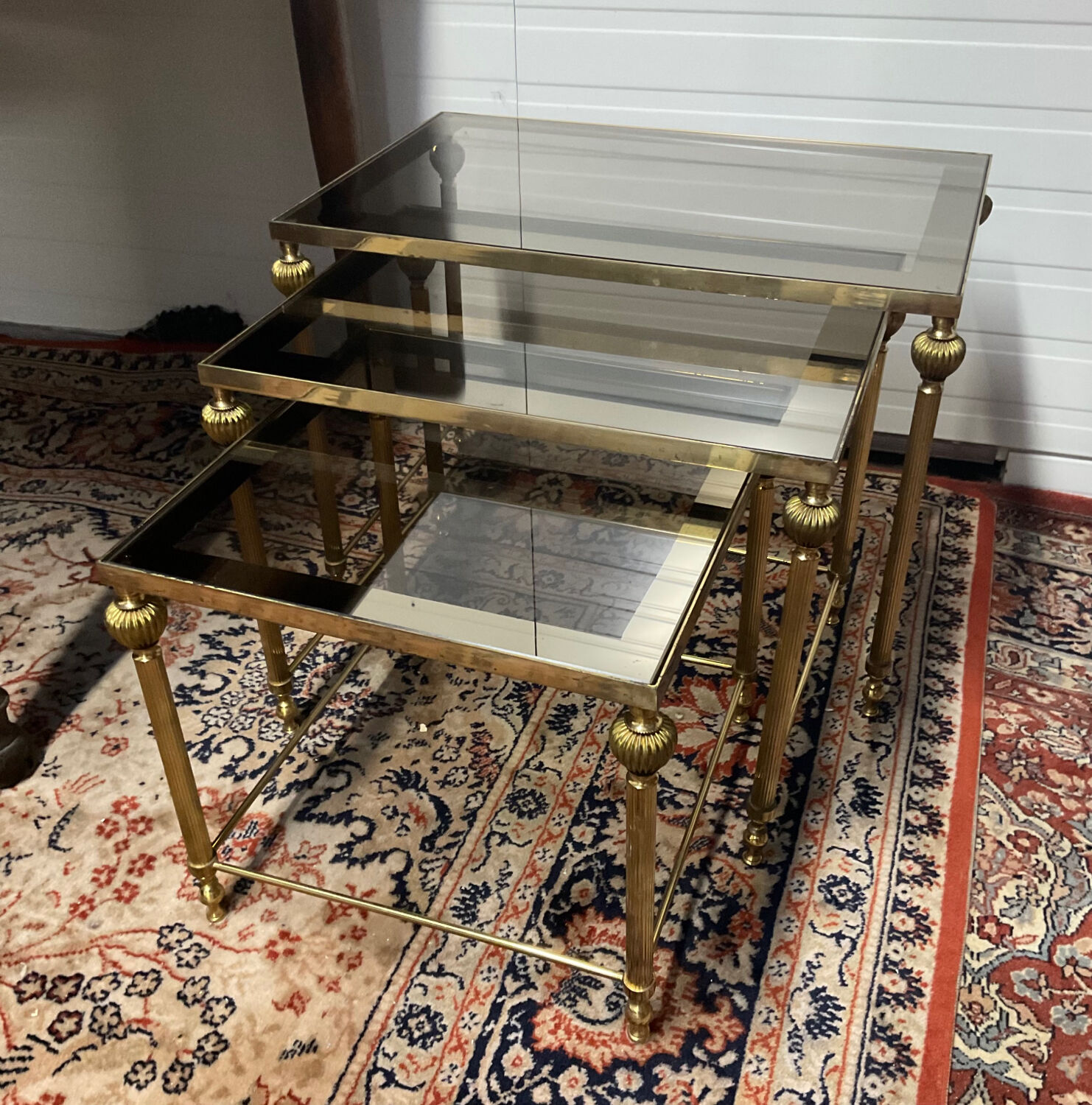 Series of 3 empire style nesting tables in brass and glass