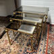 Series of 3 empire style nesting tables in brass and glass