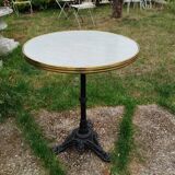 Antique bistro table with marble-decorated top