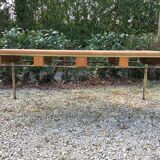 Vintage modernist table with metal tubular base and top covered with oilcloth.