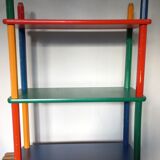 Shelf on legs, library, crayons in 4 colours.