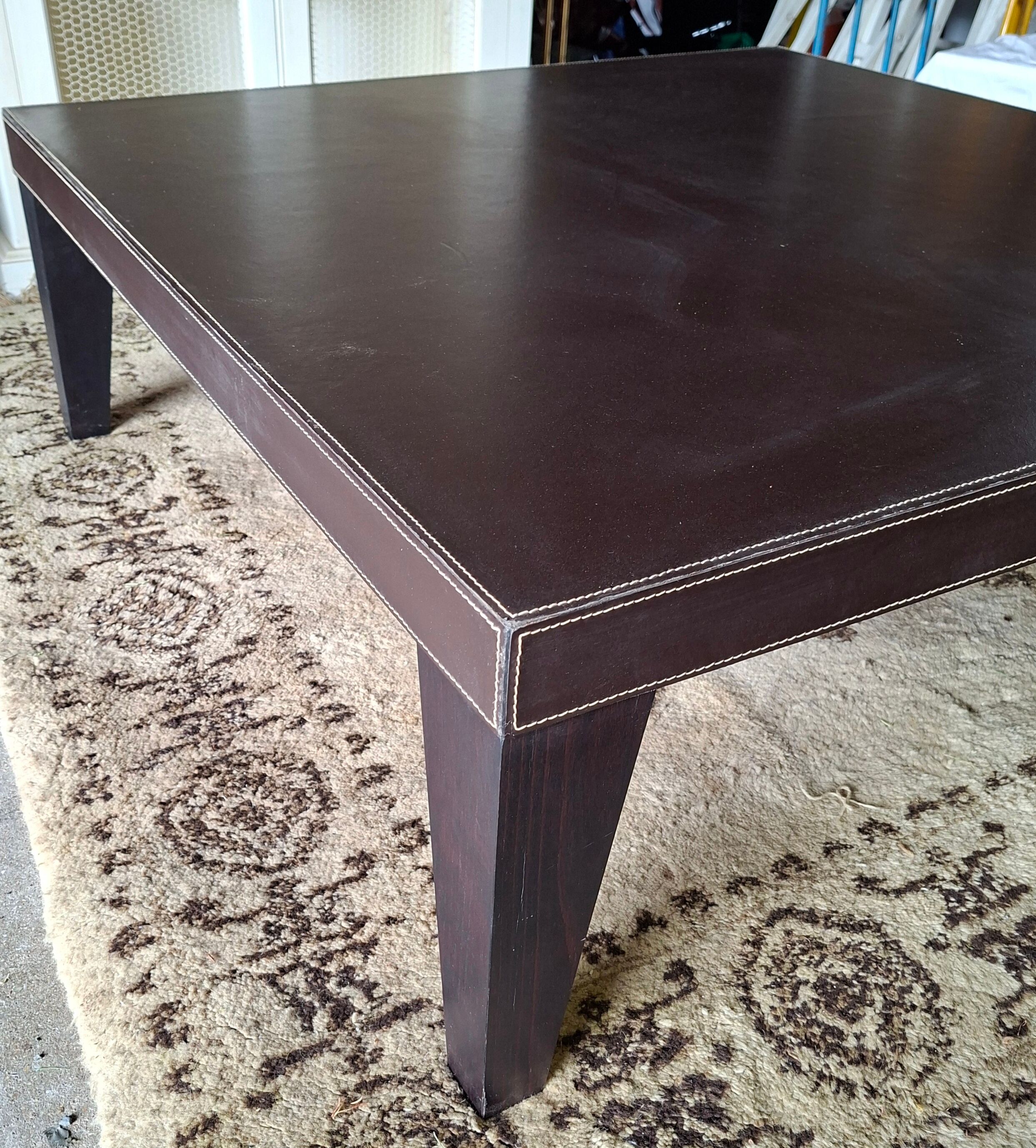 Leather-covered coffee table Roche Bobois