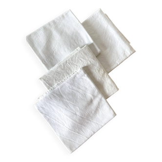 set of 4 white tea towels with white lashes, new condition