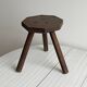 Small dark wooden tripod stool