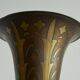 Art Deco fluted vase in patinated metal and brass from the 1930s.