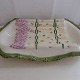 Plate of asparagus with a sauce.