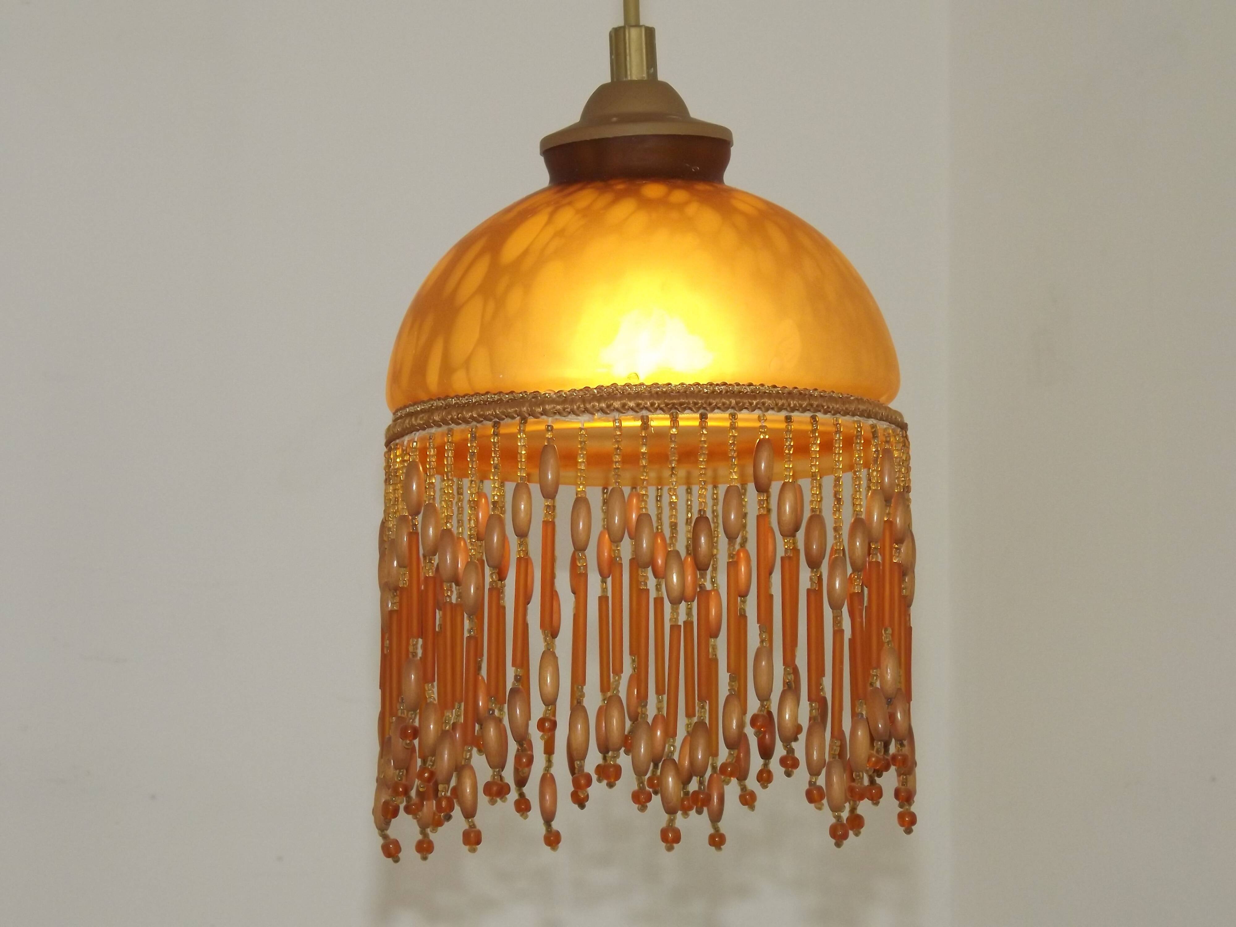 Vintage French amber mottled glass hanging ceiling light with beaded fringe.