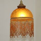 Vintage French amber mottled glass hanging ceiling light with beaded fringe.