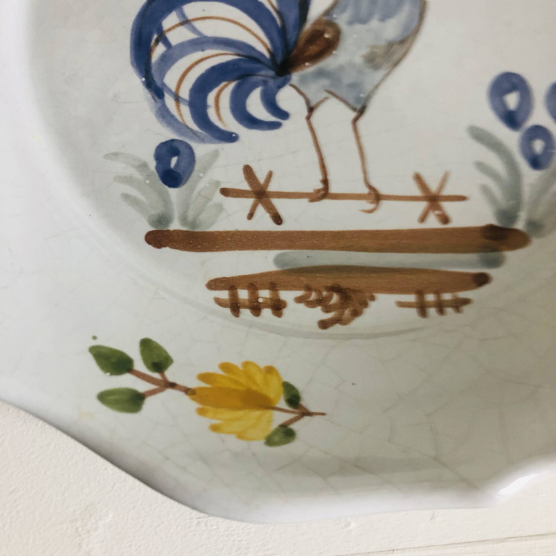 Pair of plates with naive Eastern rooster decoration