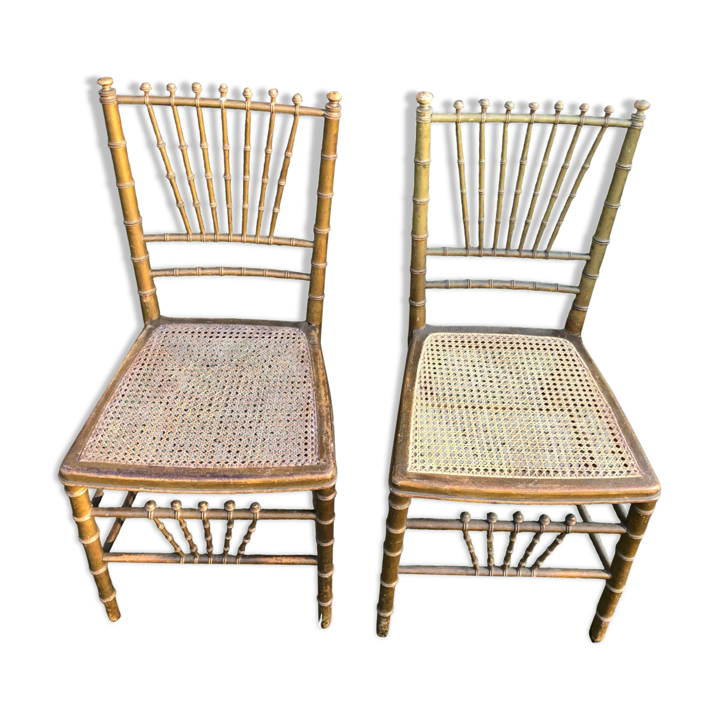 Pair of caned chairs in gilded wood