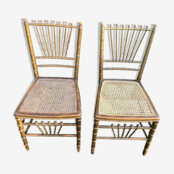 Pair of canned chairs in gilded wood