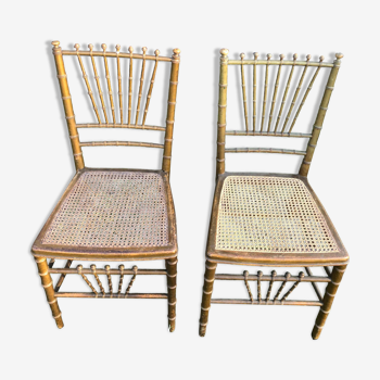 Paire de chaises cannées en bois doré
