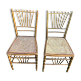 Pair of caned chairs in gilded wood