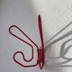 Pair of red metal wall hooks