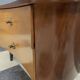 small kidney shaped cabinet with glass on top 1960s