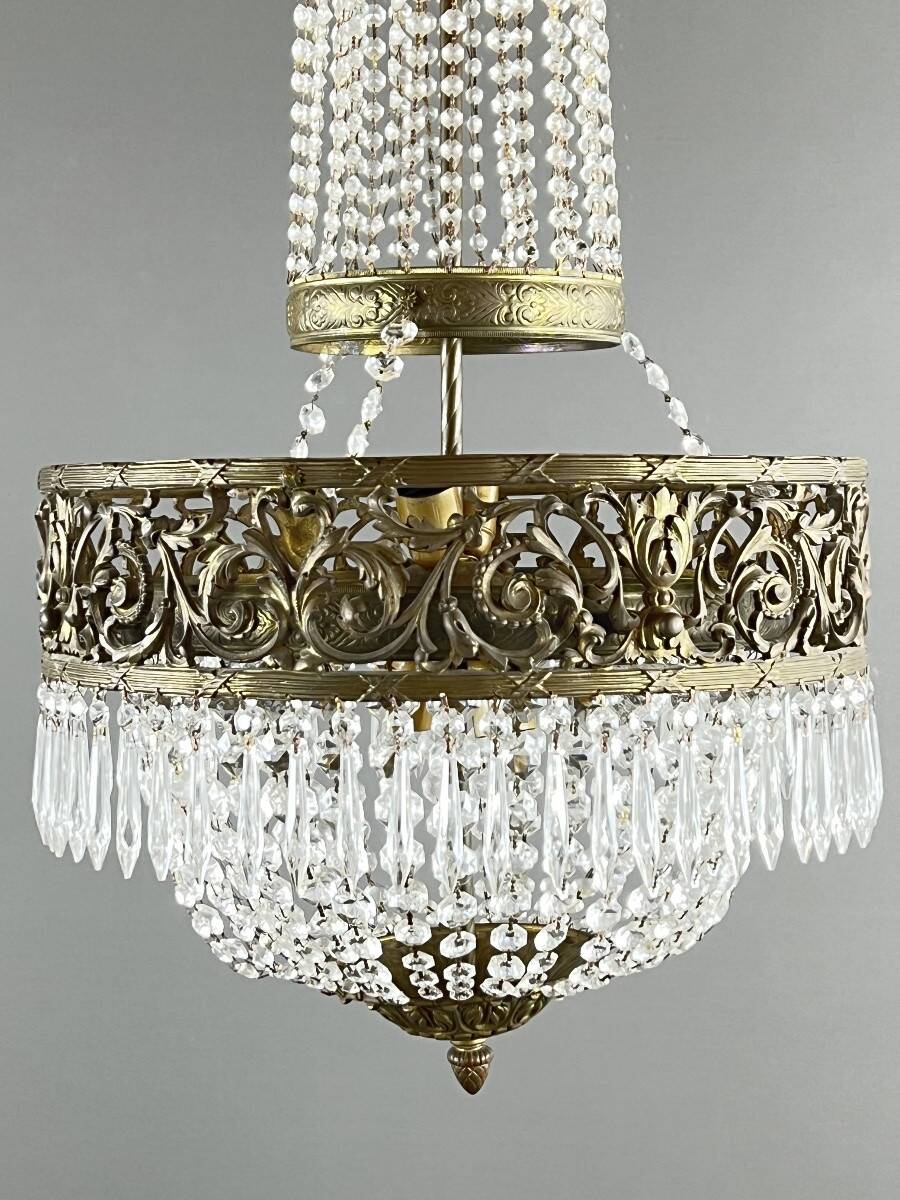 Empire-style chandelier in bronze with crystal pendants, early 20th century.