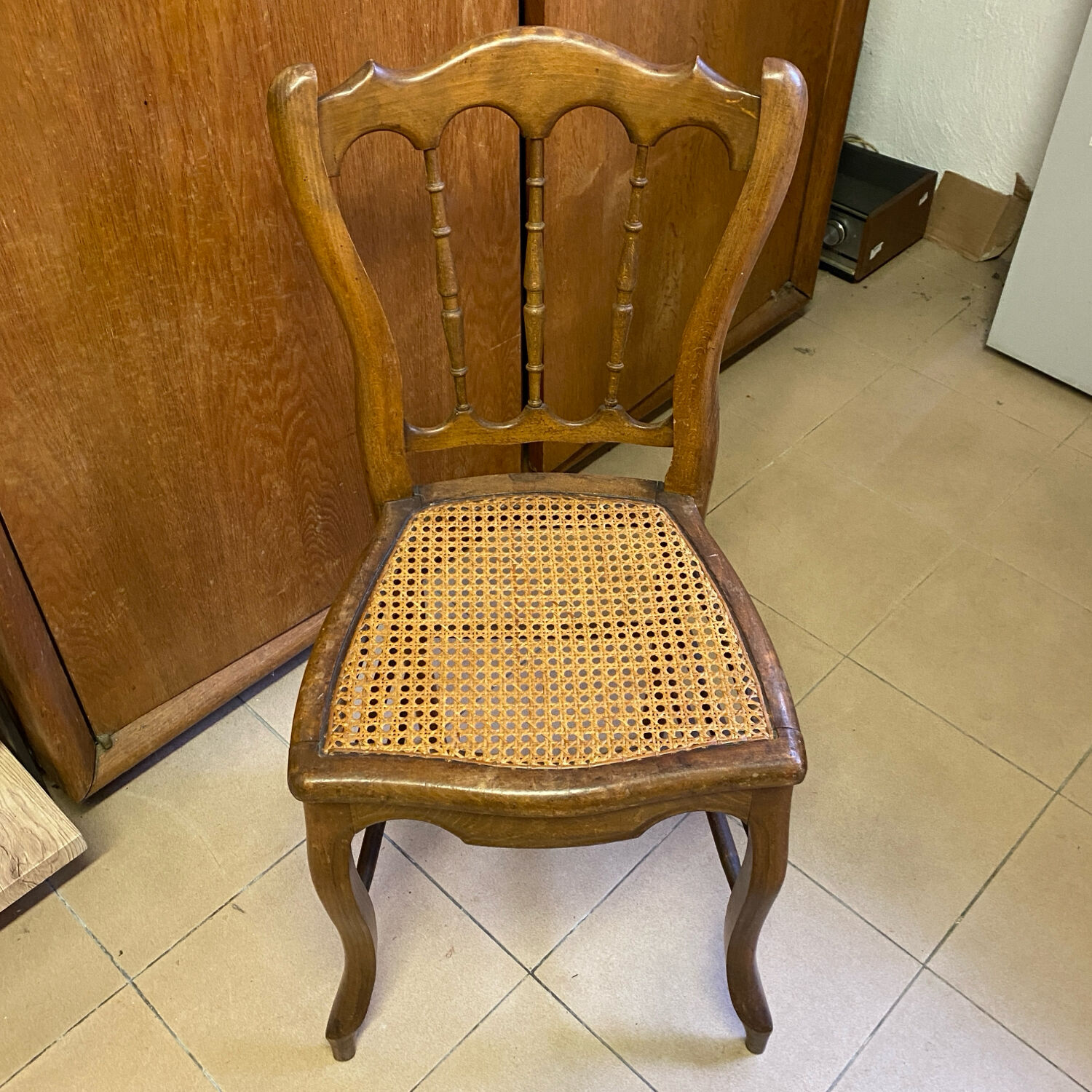 Antique wooden chair, cane seat