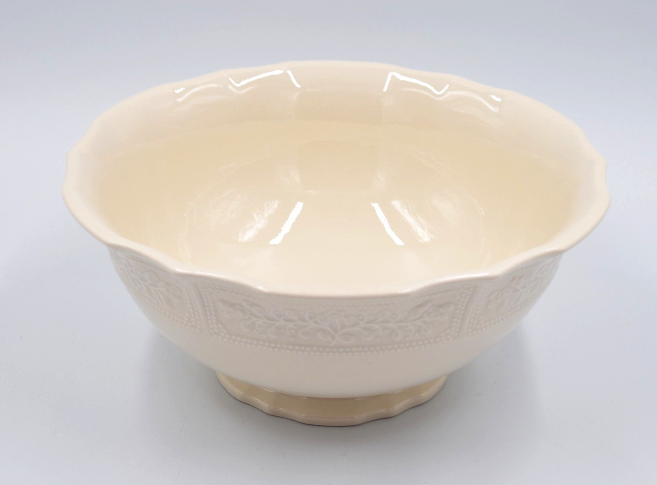 Salad bowl in off-white earthenware ivory Lunéville decoration in relief France