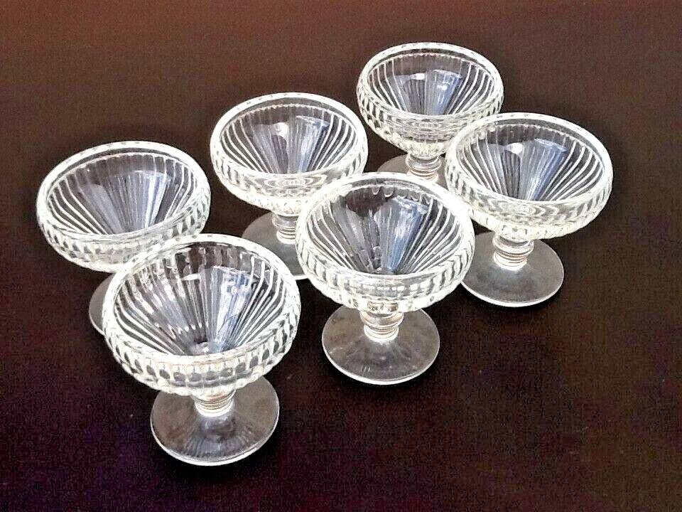6 footed ice cream bowls, ribbed transparent glass, Made in France.