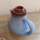Ceramic teapot in blue/grey glaze, signed by Jeanne and Norbert Pierlot.
