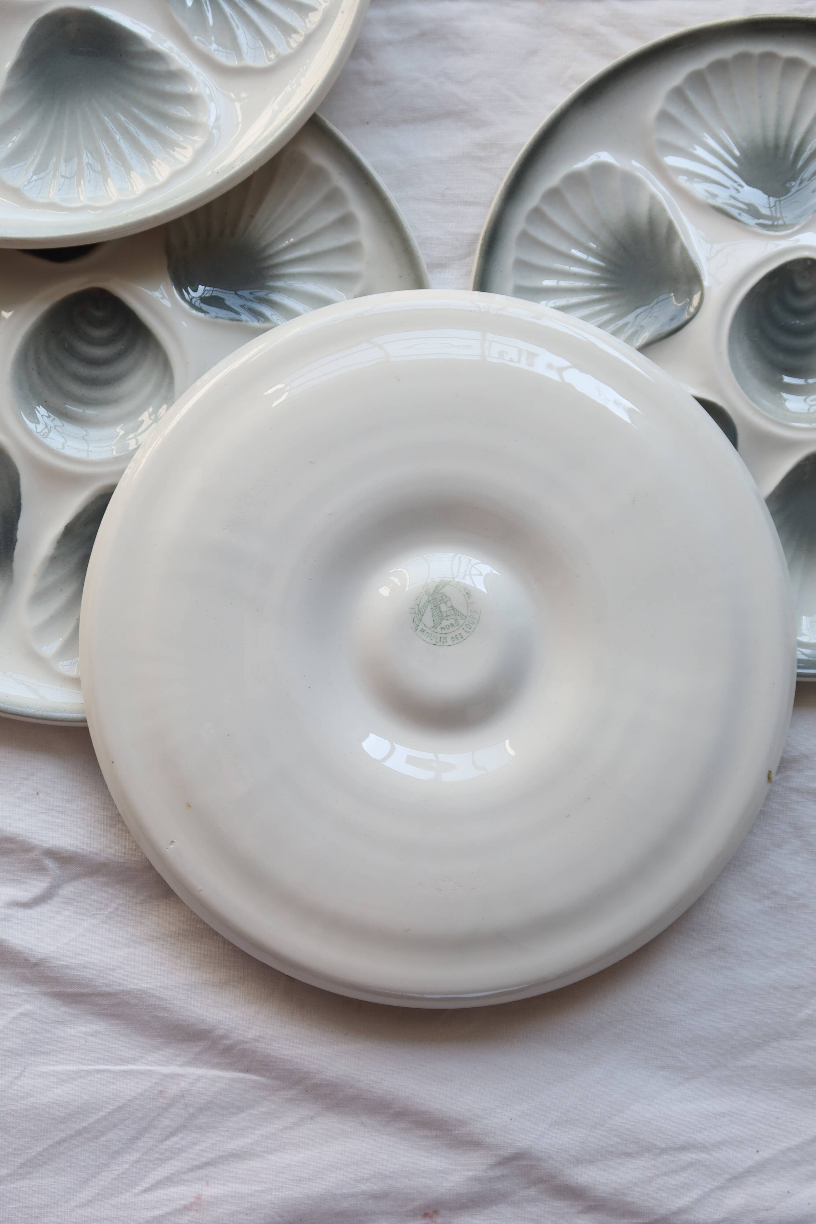 6 vintage Moulin des Loups earthenware oyster plates in shades of blue and grey