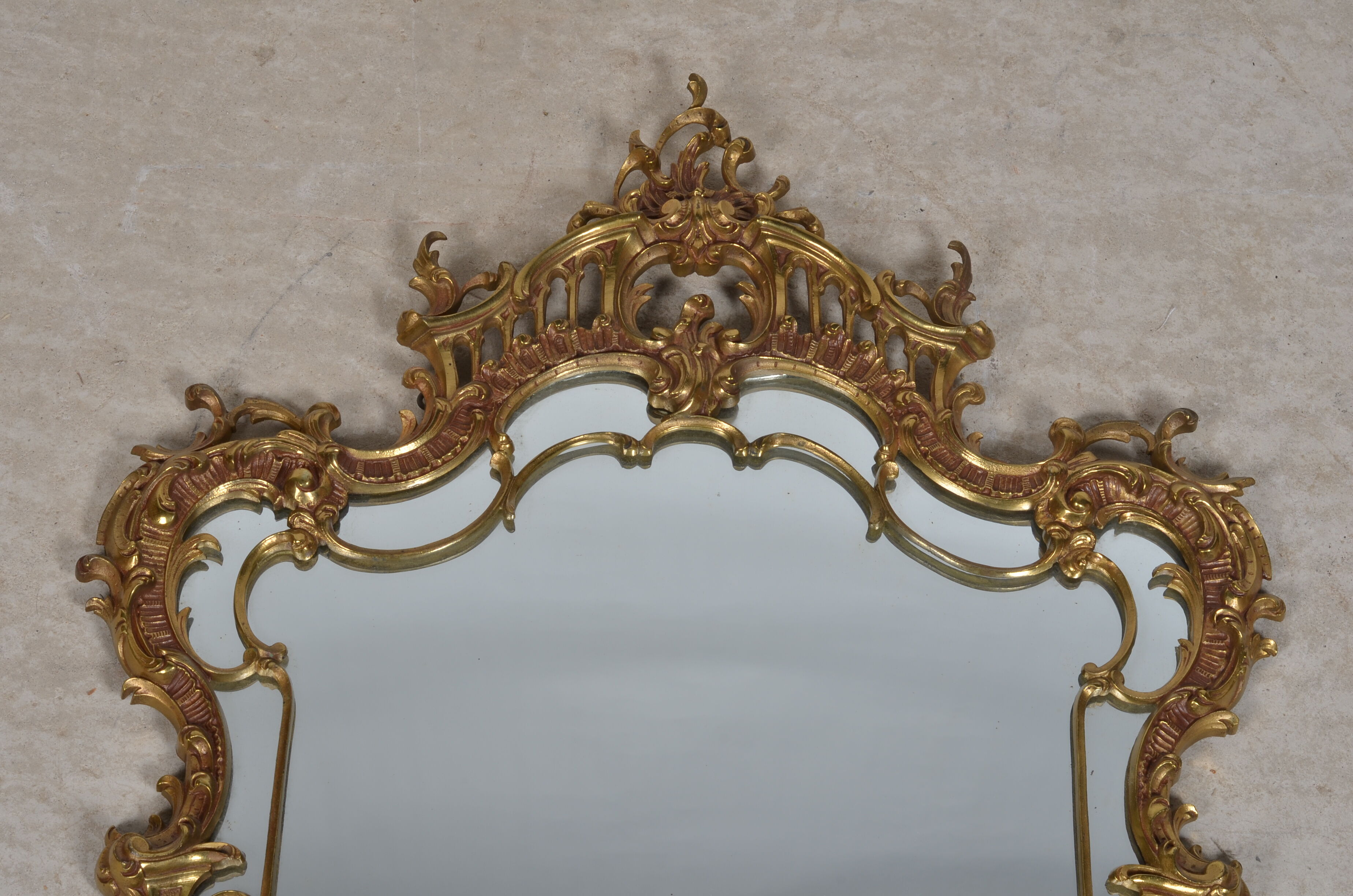 Mirror with baroque style parecloses in bronze 102 x 61 cm