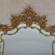 Mirror with baroque style parecloses in bronze 102 x 61 cm