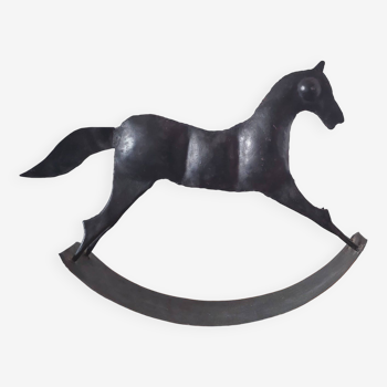 Stylized rocking horse in 60s design sheet metal