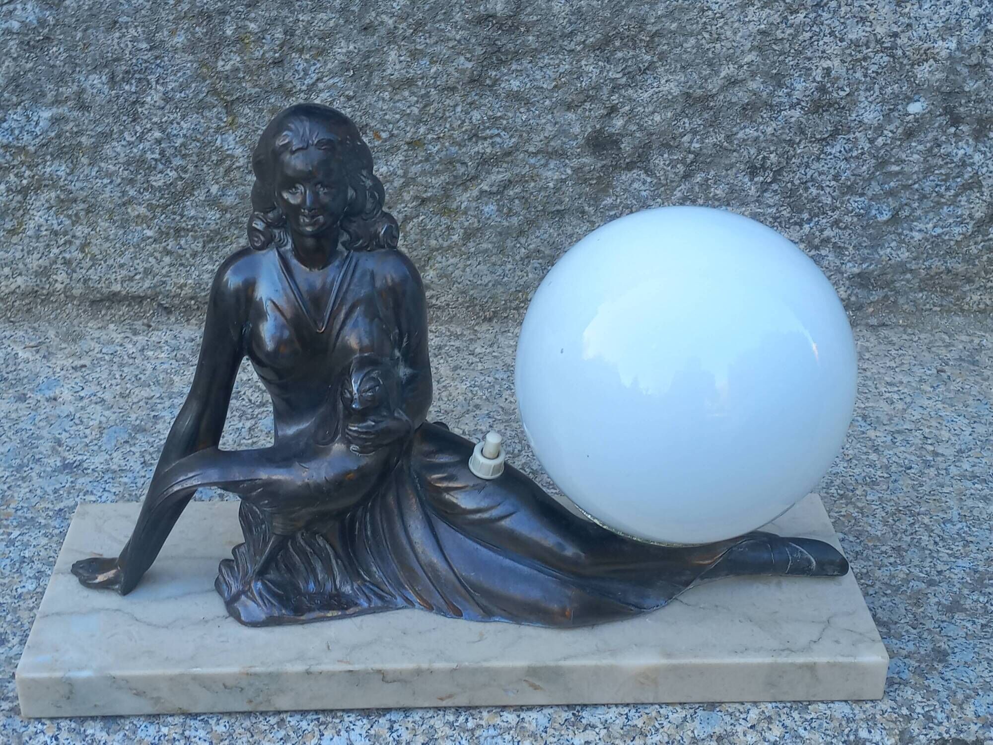 Art Deco lamp in cast iron and marble with a white opaline globe.