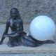 Art Deco lamp in cast iron and marble with a white opaline globe.