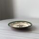 Very decorative serving plate in terracotta, floral and geometric motifs.
