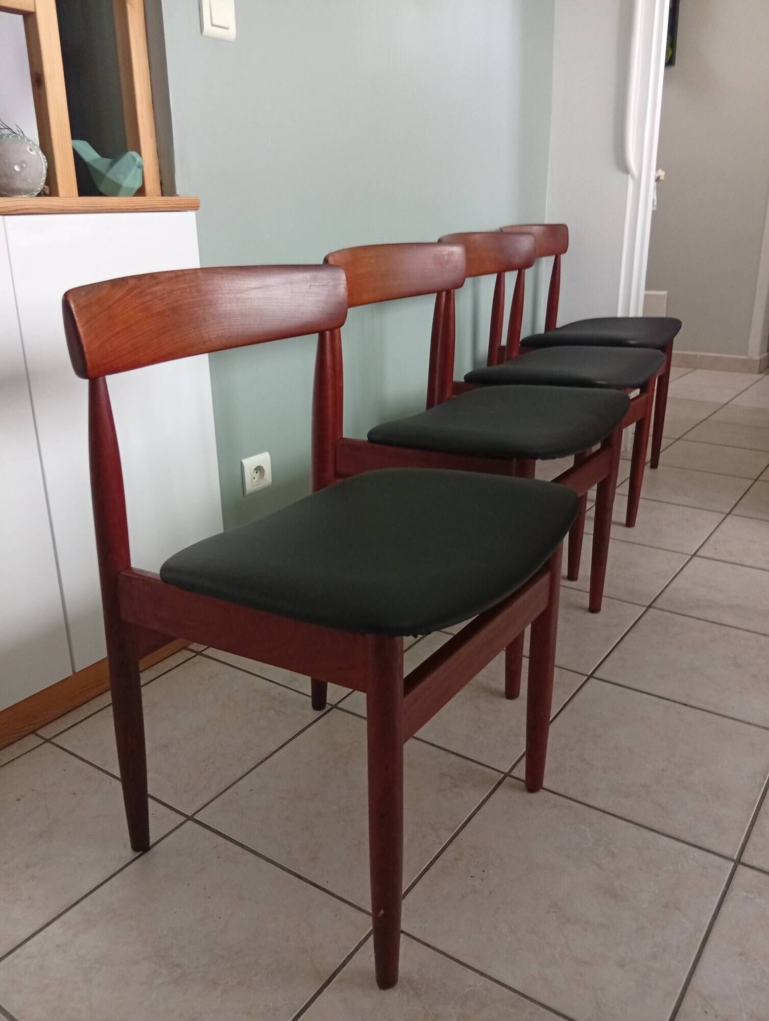 Four Danish mid-century teak armchairs.