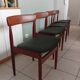 Four Danish mid-century teak armchairs.