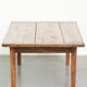 Antique pinewood coffee table with a drawer and a rural appearance