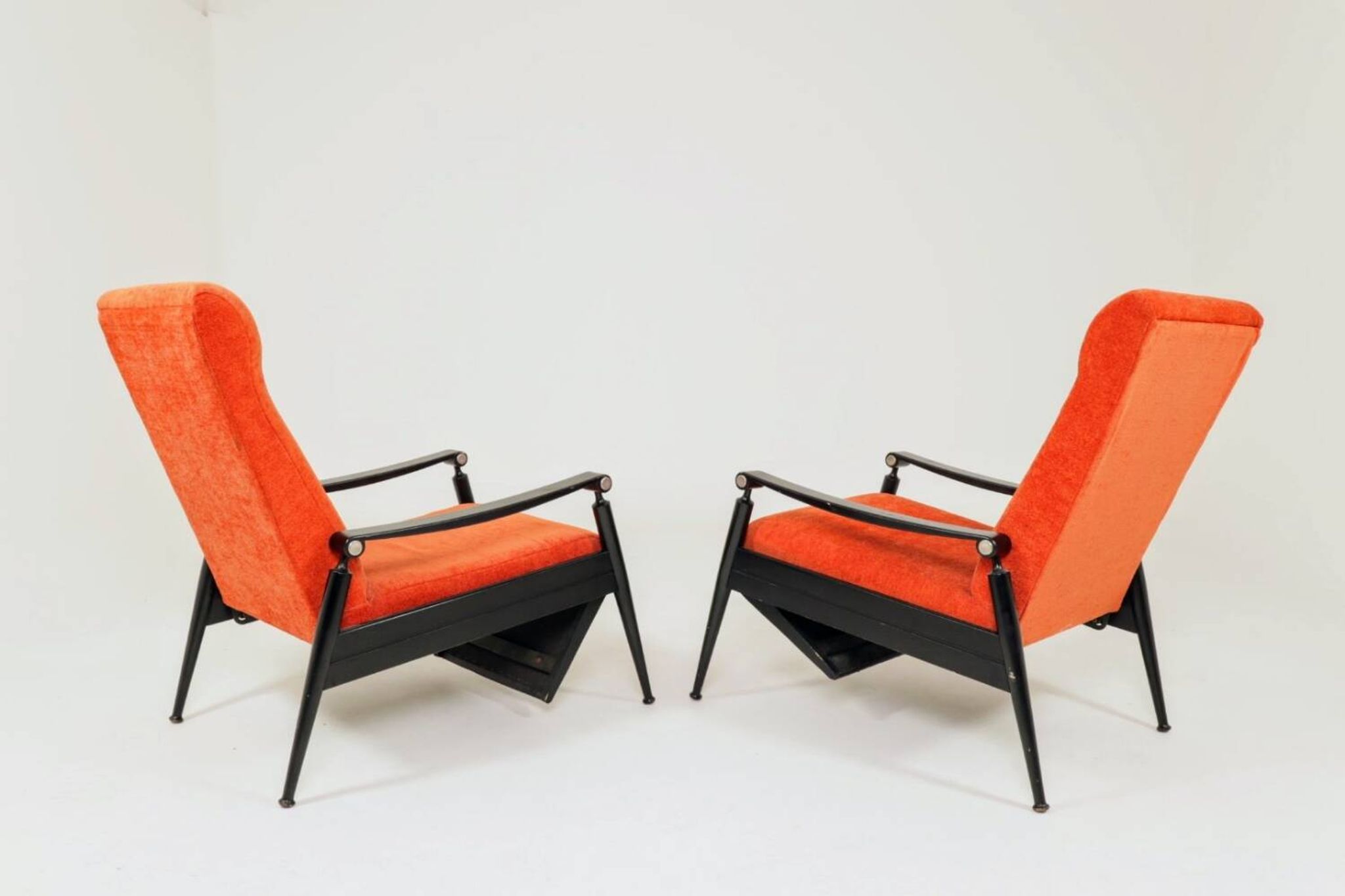 Pair of vintage armchairs in burnt orange, MCM design from the 1960s.