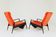 Pair of vintage armchairs in burnt orange, MCM design from the 1960s.