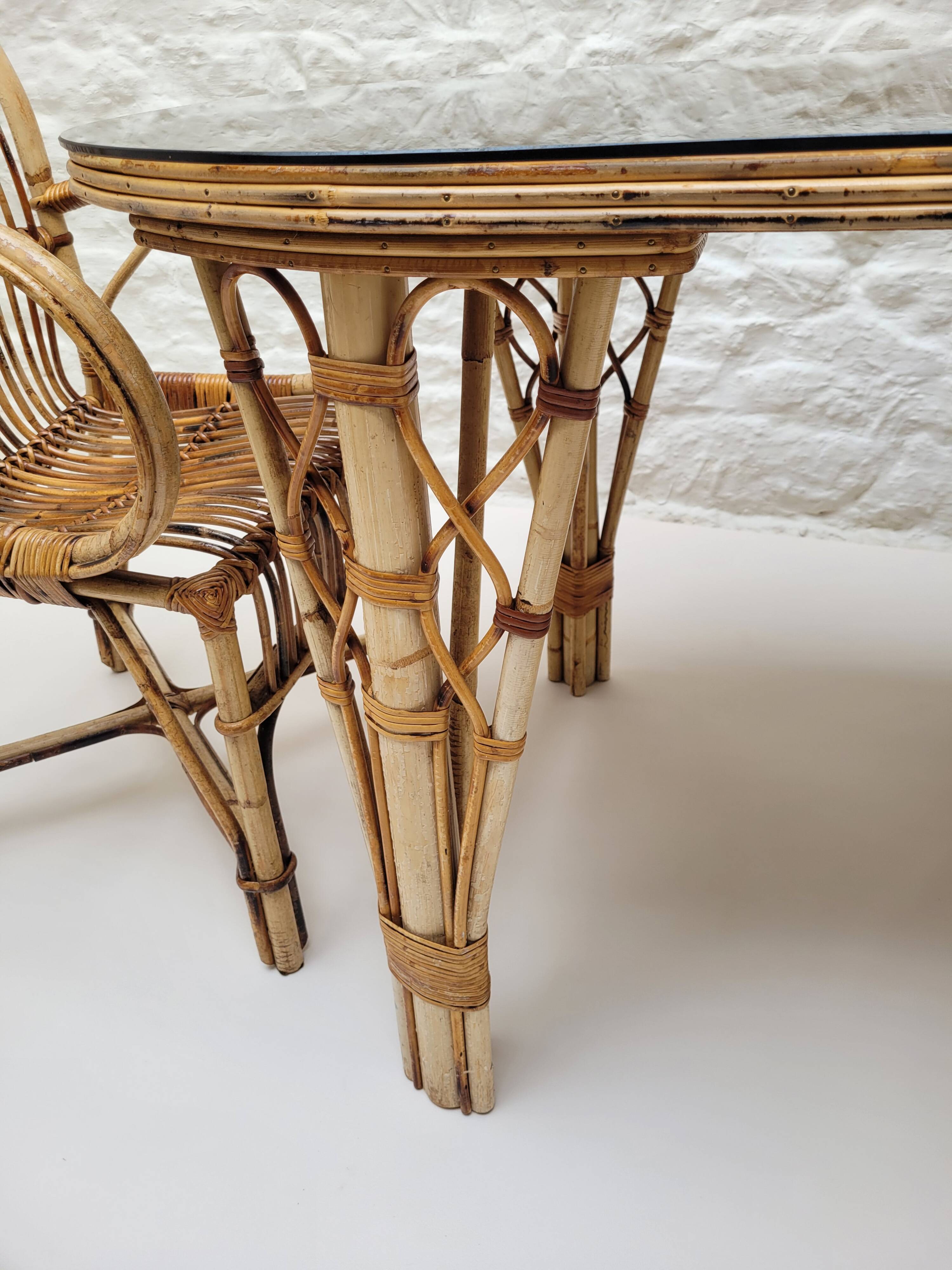 Vintage Audoux Minet bamboo, rattan, and smoked glass table duo.