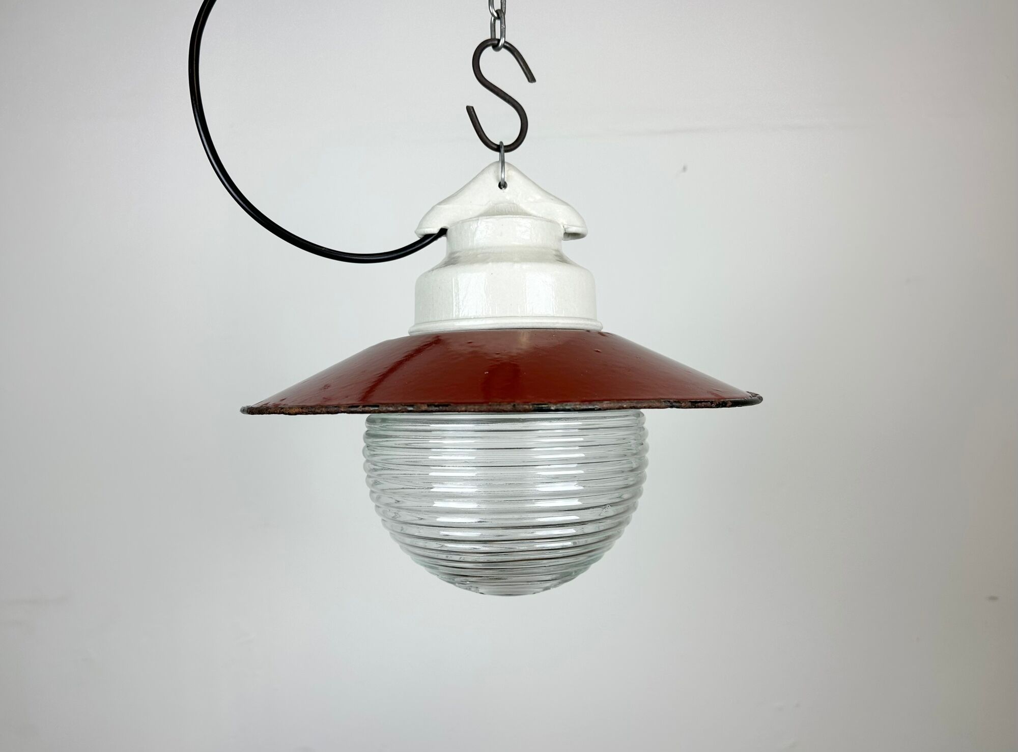 Industrial porcelain red enamel pendant light with ribbed clear glass, 1970s
