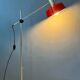 Adjustable red floor lamp in the style of Hoogervorst.