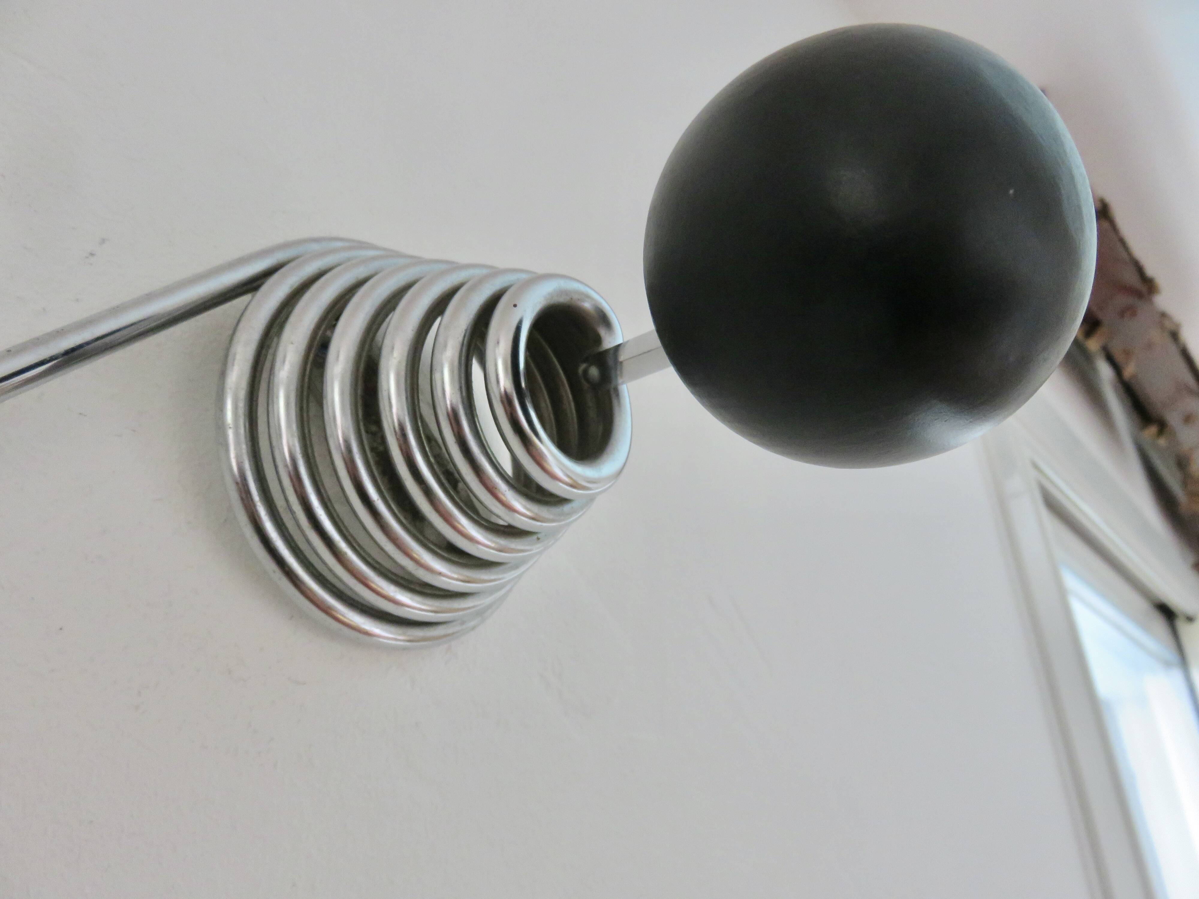 "Streamline" wall coat rack in chromed metal and black lacquered wood, 1970.