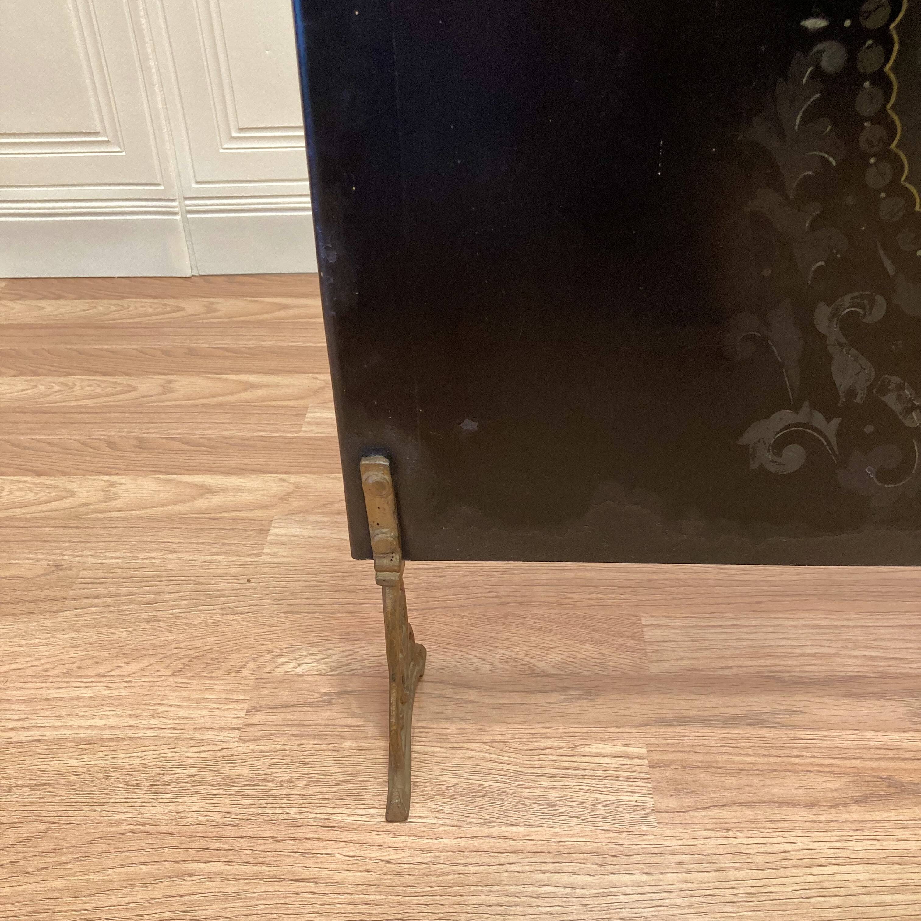 Antique metal fireplace screen.