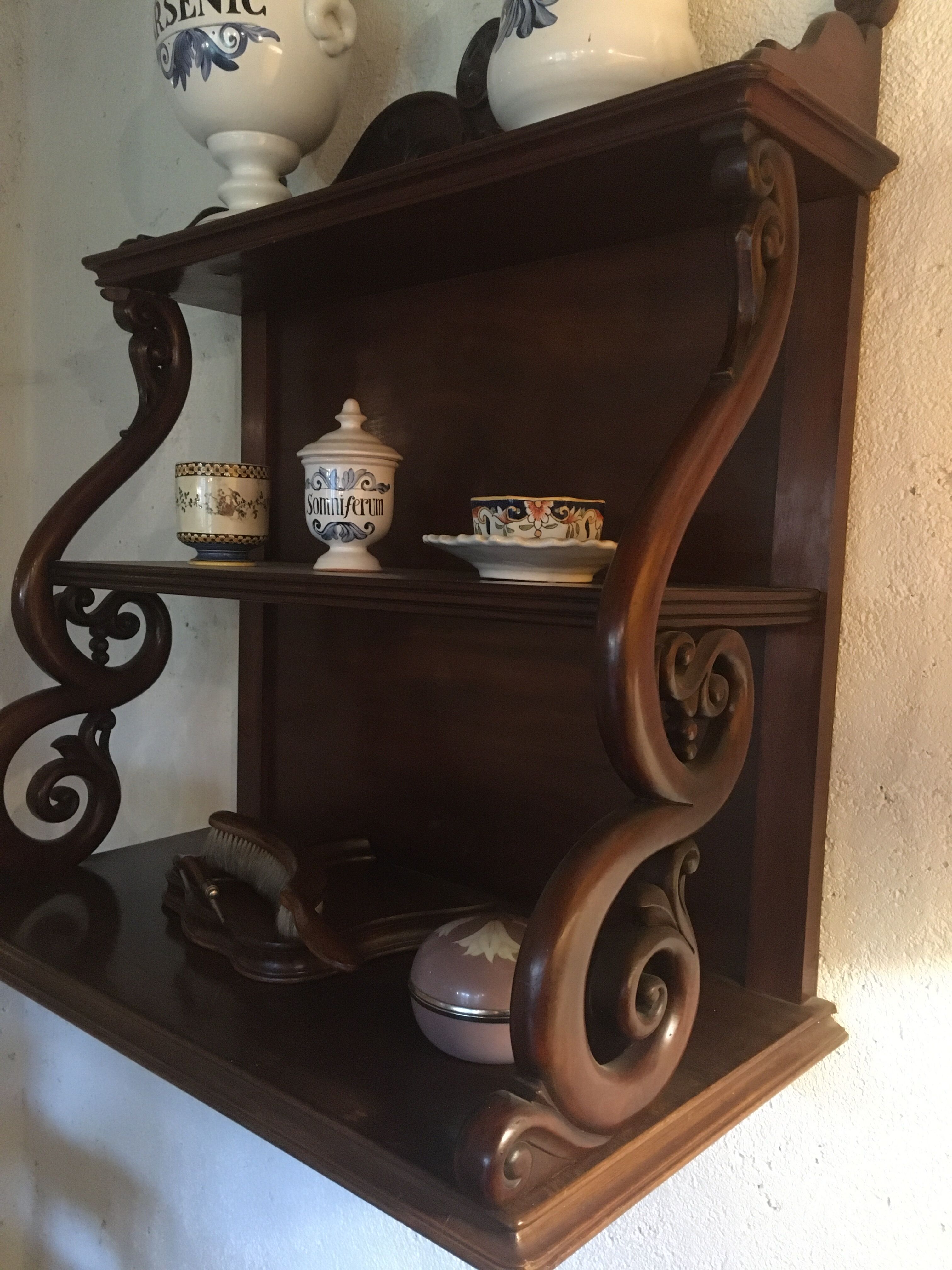 Carved wooden wall shelf.