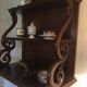 Carved wooden wall shelf.