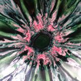 Green faience bowl decorated with multicolored drips around 1970