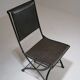 Foldable chair in wrought iron and leather. c. 1950