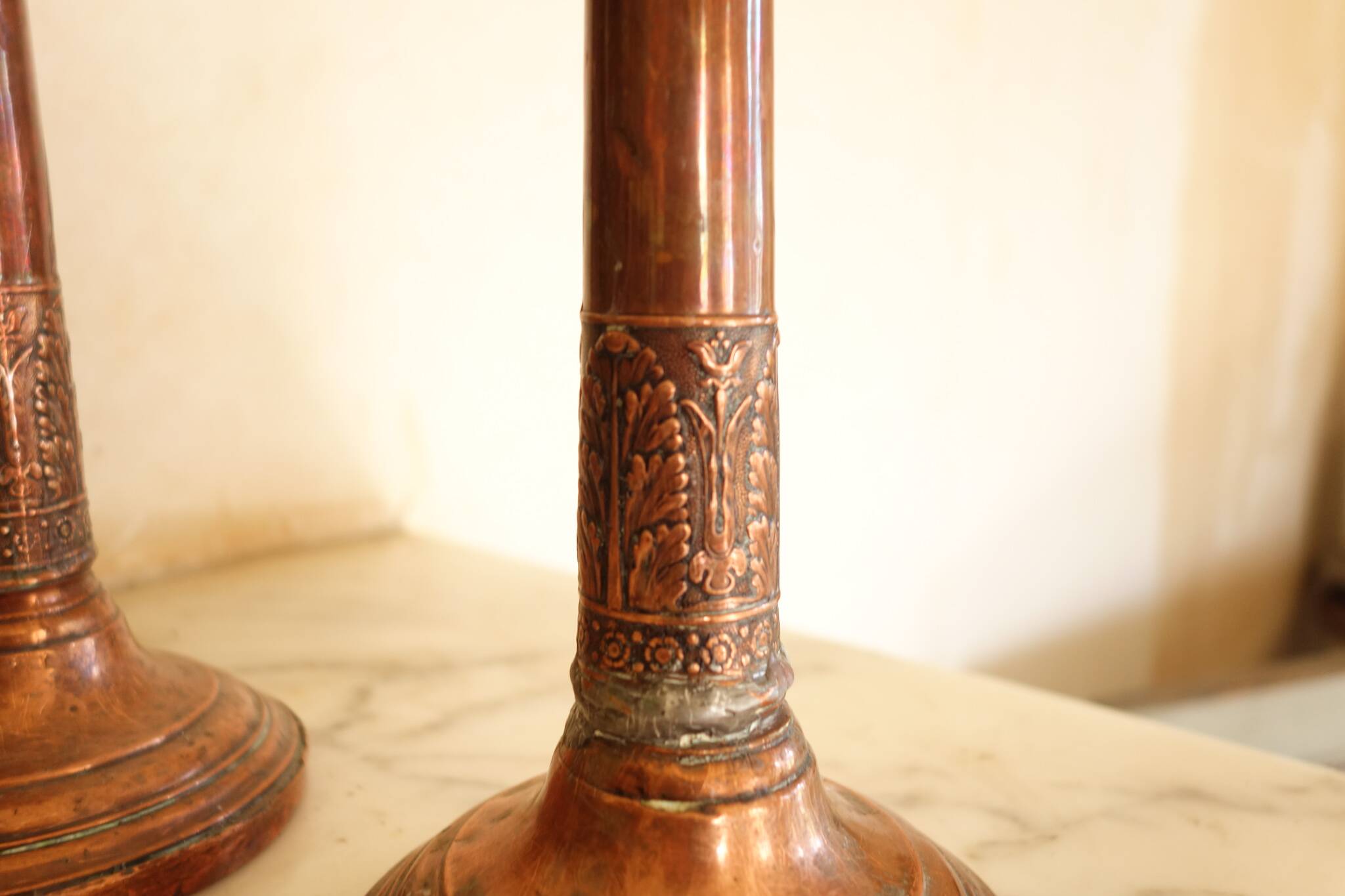 Pair of antique copper candlesticks