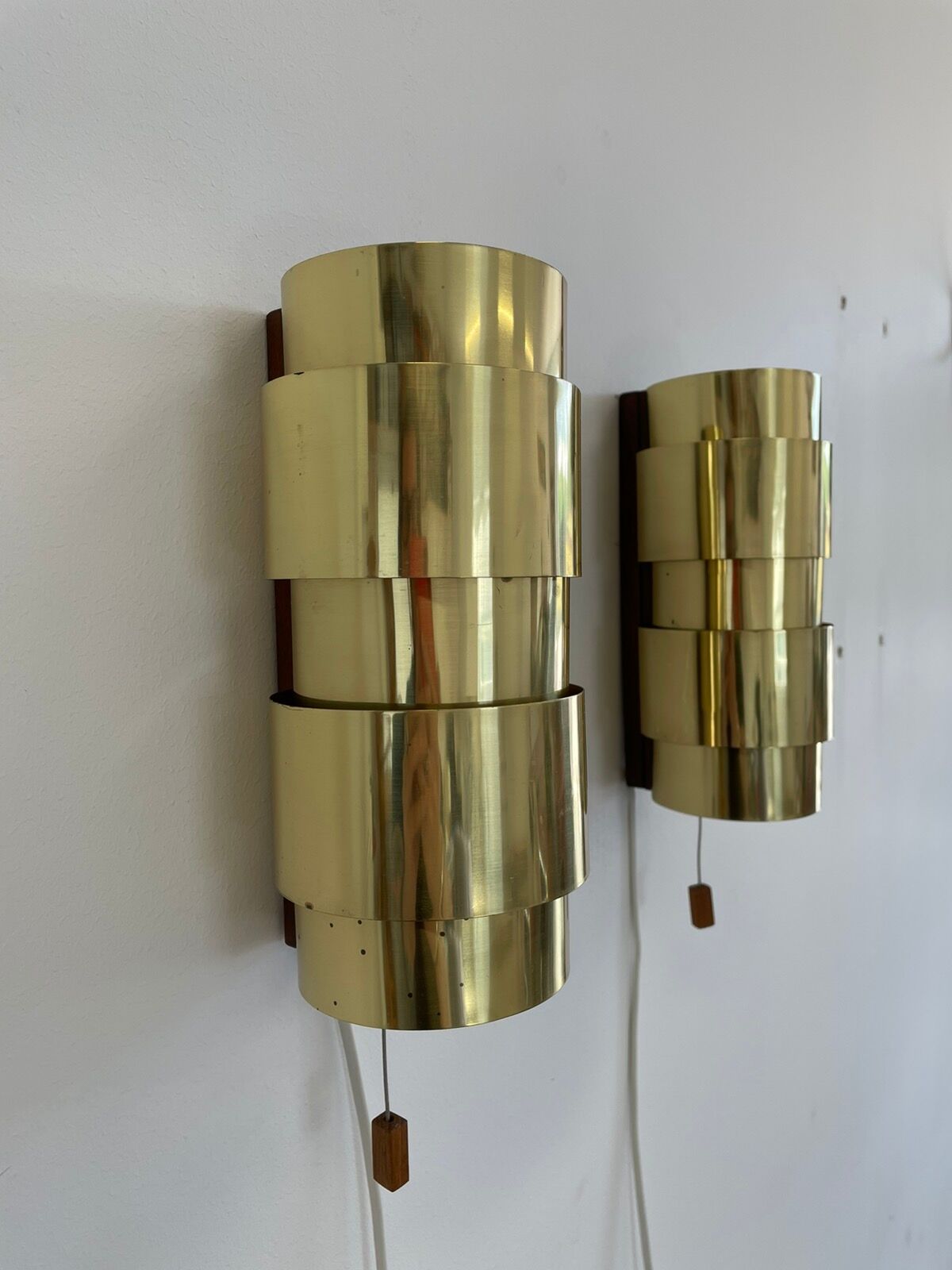 Pair of Scandinavian teak and brass sconces