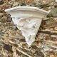 Antique wall console in patinated white plaster.