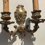 Pair of Louis XV style two-branch gilt bronze wall lights, small format and in good condition. Height 18 Width 20 cm