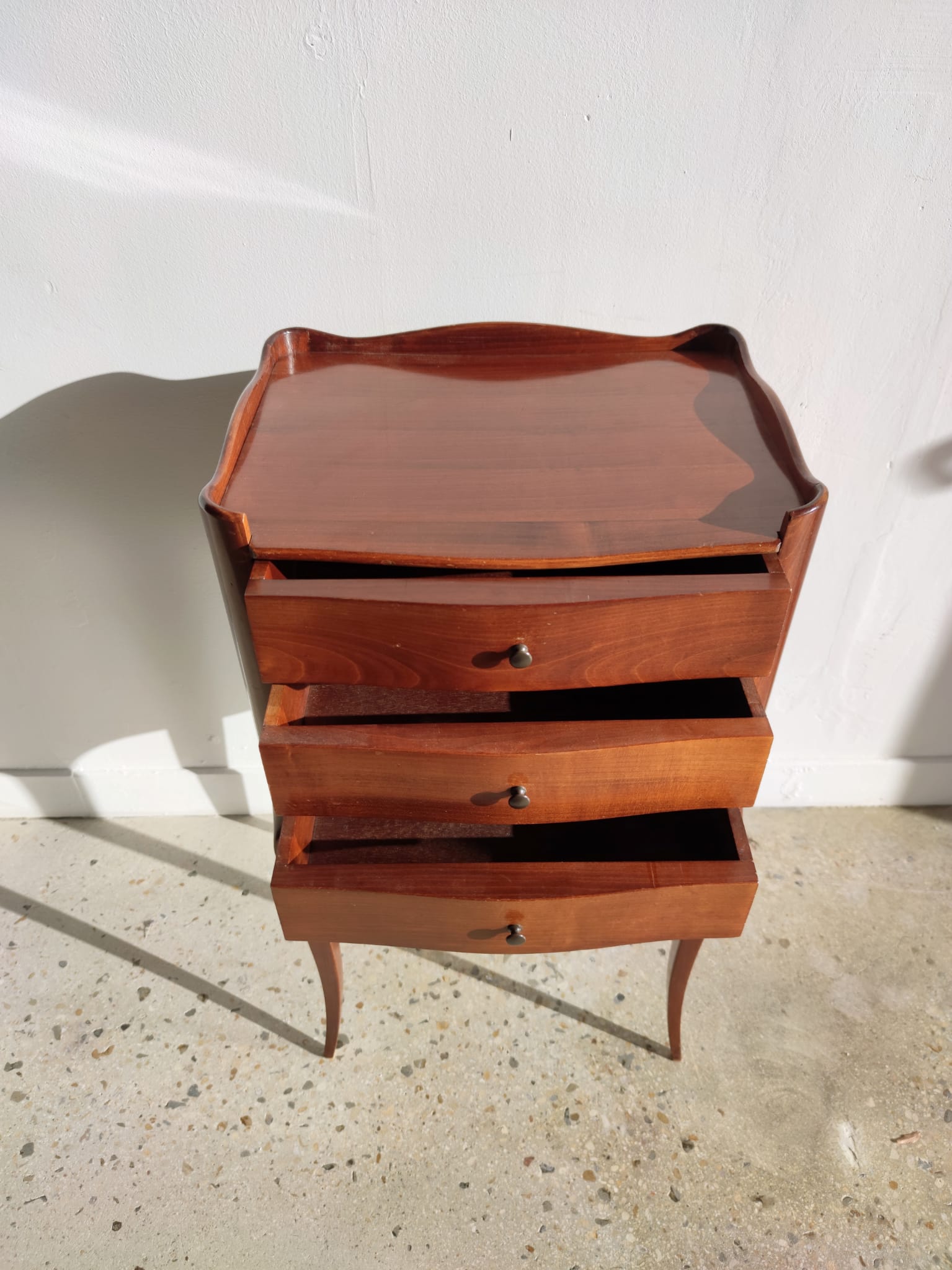 Three-drawer cherry bedside table